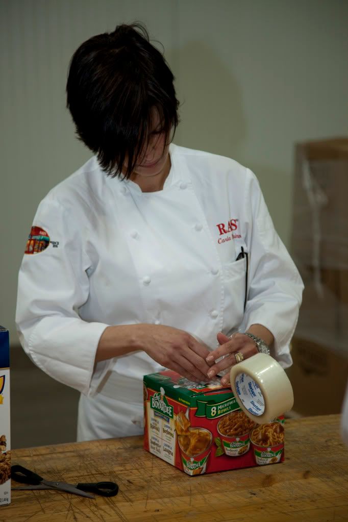 Chef Carla Pellegrino Meets Chef Boyardee at the Three Square Food Bank (photo by: Kevin Stout) Chef Carla Pellegrino Meets Chef Boyardee at the Three Square Food Bank (photo by: Kevin Stout)